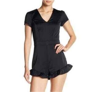 NWT Bebe Womens V-Neck Ruffle Romper in Jet Black. Size 8